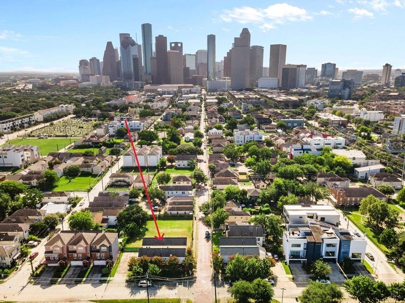 Aerial view of a Houston neighborhood with downtown in the distance, one of Michael O'Neal's listings