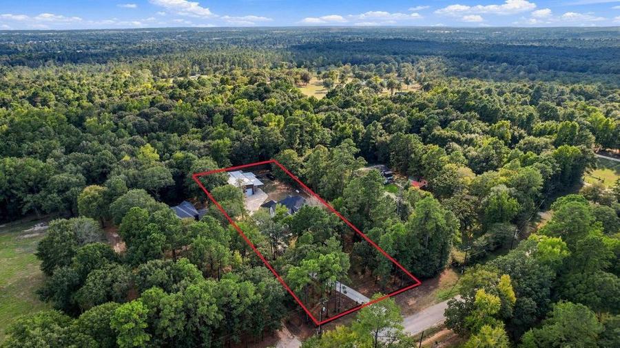 Aerial view of 19691 Village Forest Dr and the surrounding neighborhood