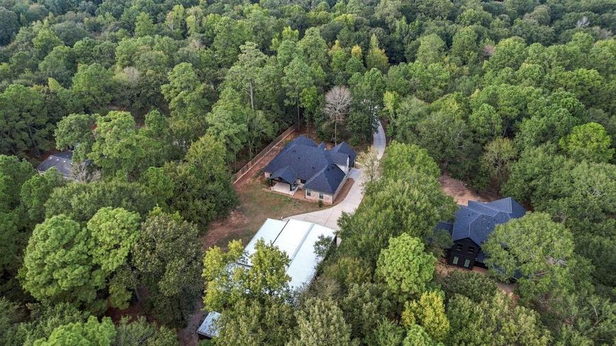 Aerial view of 19691 Village Forest Dr and the surrounding neighborhood