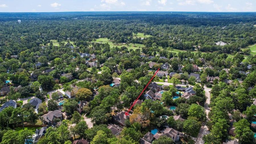 Aerial view of 15 Crestone Pl and the surrounding neighborhood