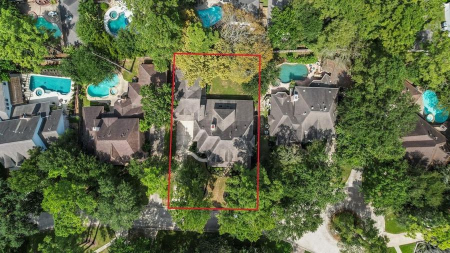 Aerial view of 15 Crestone Pl and the surrounding neighborhood